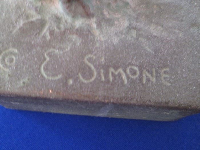 Signed E. Simone