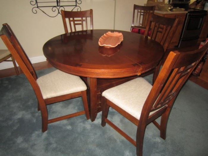 Kitchen table with hidden leaf and six chairs