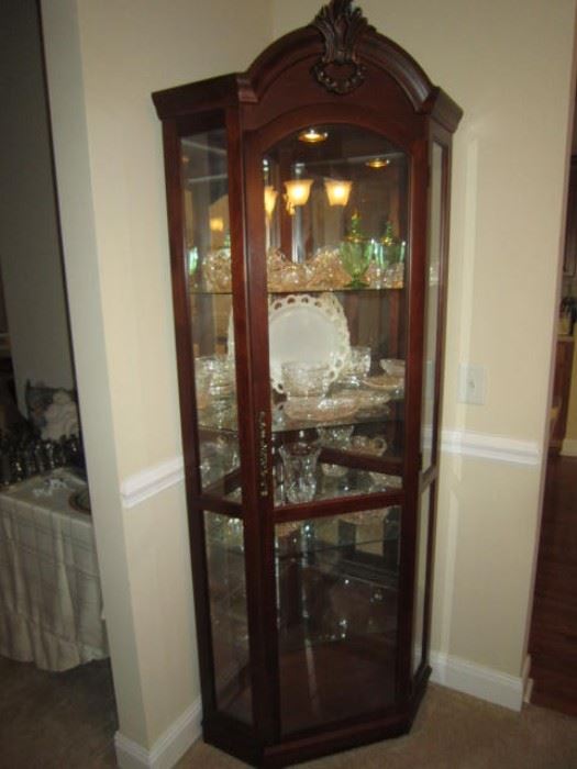 Corner cabinet, glass shelves, light