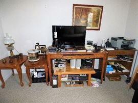 Office items, antique electrified oil lamp on far right, hand made desk, printers, flat screen tv