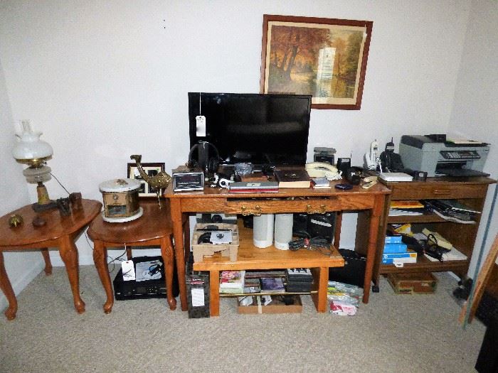 Office items, antique electrified oil lamp on far right, hand made desk, printers, flat screen tv
