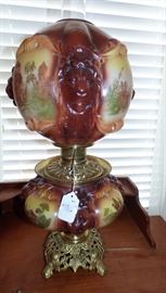 Antique electrified oil lamp by Consolidated with embossed lions on shades & handpainted scenes