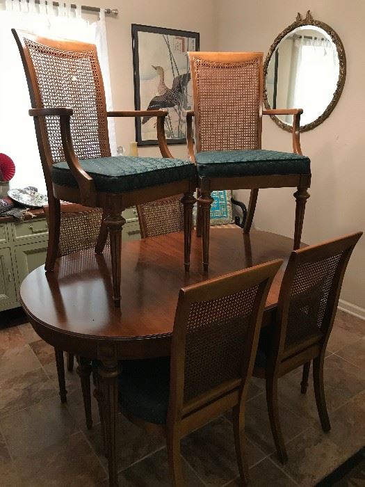 Vintage dining room table, includes 3 leaves, 2 captains chairs with arms and 4 chairs.  This set also includes painted buffet and mirror.