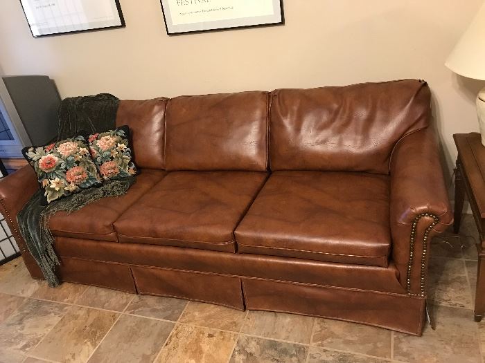 Leather look vinyl couch.  Perfect for a family with kids or pets!