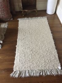 one of two matching rugs