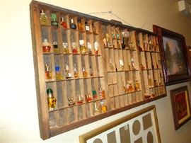 miniature perfume bottles, have been glued in