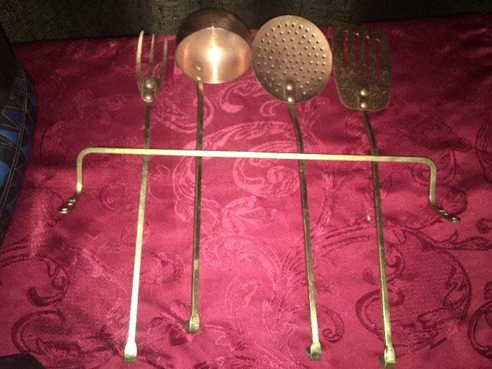 Set of four brass large kitchen utensils.