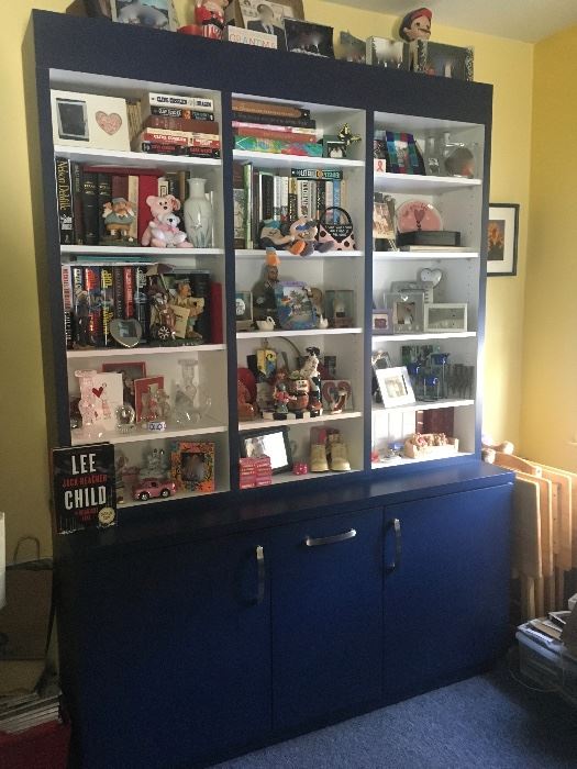 Books & collectibles & blue wall unit 