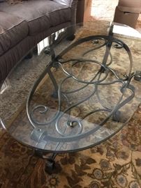 Glass top coffee table withornate design. (Rug in picture is NOT for sale)