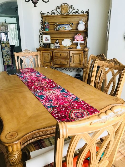 Elegant blonde wood dining room table (two leaves to make full banquet) and eight chairs