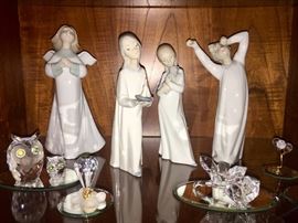 Lladros and Swarovski, most with boxes