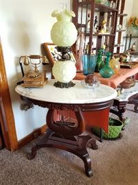 Oval Marble top lamp table with Fenton lamp and Onyx telephone