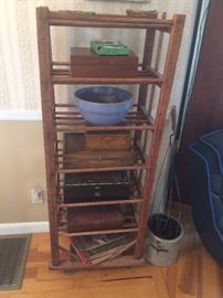 Very cool 7 shelf stand with large metal wheels. Thought to be a baker's rack as owner's father was a baker.
