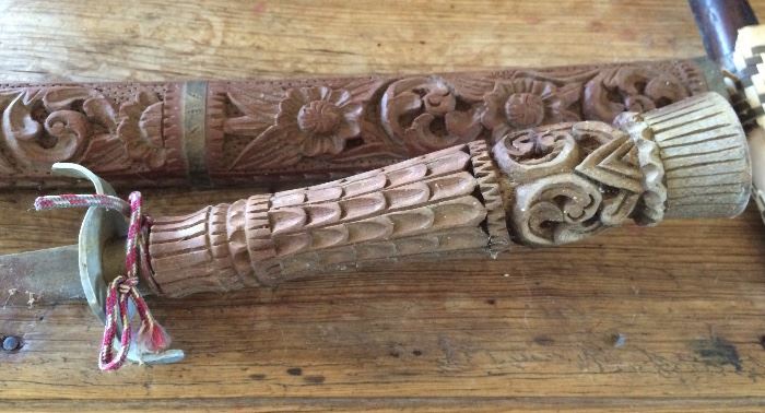Large carved sword in scabbard