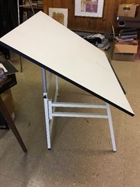 There are three drafting tables available