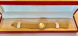 Movado gold and diamond watch