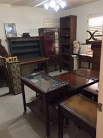 Loads of desks, tables, cabinets, shelves and a beverage cart