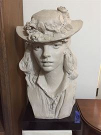 Lady with a flower hat statue