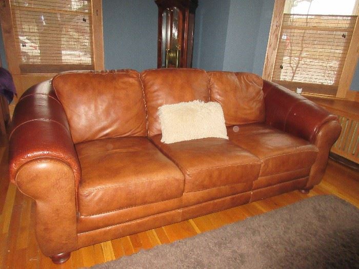 There are 2 of these soft leather sofas