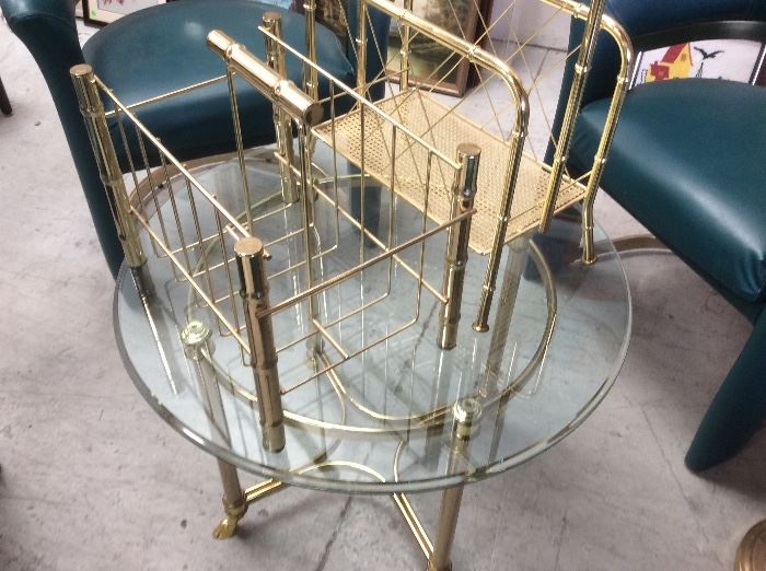 Round gold and glass side table, gold magazine holders