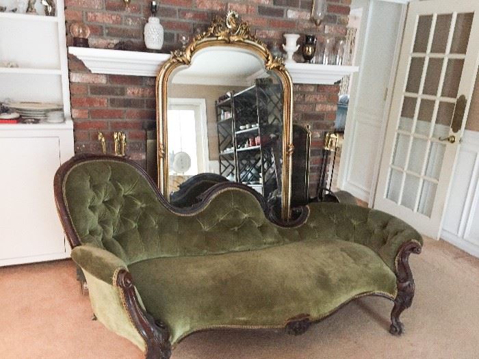 Antique chaise lounge and vintage hall mirror