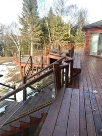 DECK!  Looking for decking material?  This can be removed piece by piece.  Buyer is responsible.  Deck boards, railing, stairs, glass panels