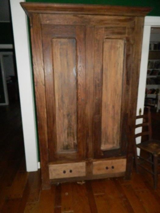 Primitive armoire.  Has been retrofitted with adjustable brackets and cut shelving.
