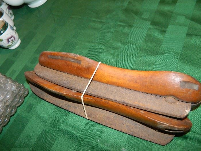 Wooden and steel ice skates that were attached to shoes with leather binding.