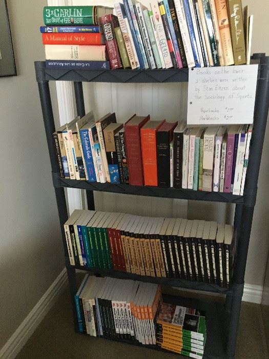 Books on  bottom two shelves by Stan Eitzen