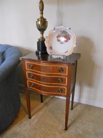 One of a pair of curved front end tables with 3 inlay outlined drawers 