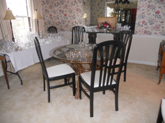 Rattan type glass top table with 6 black high back chairs