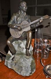 Bronze statue of a guitarist