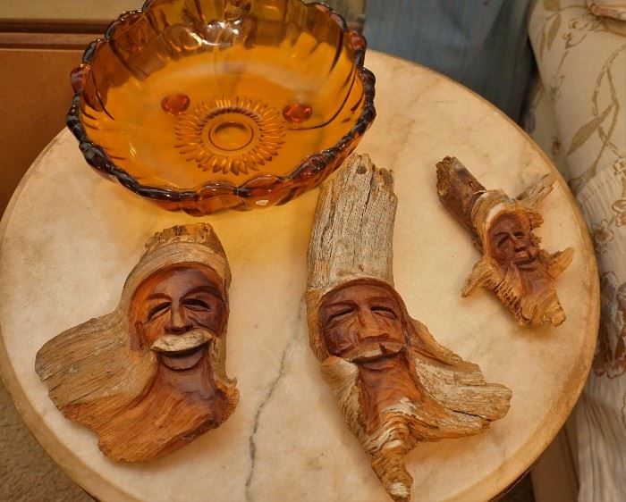 Carved wooden faces