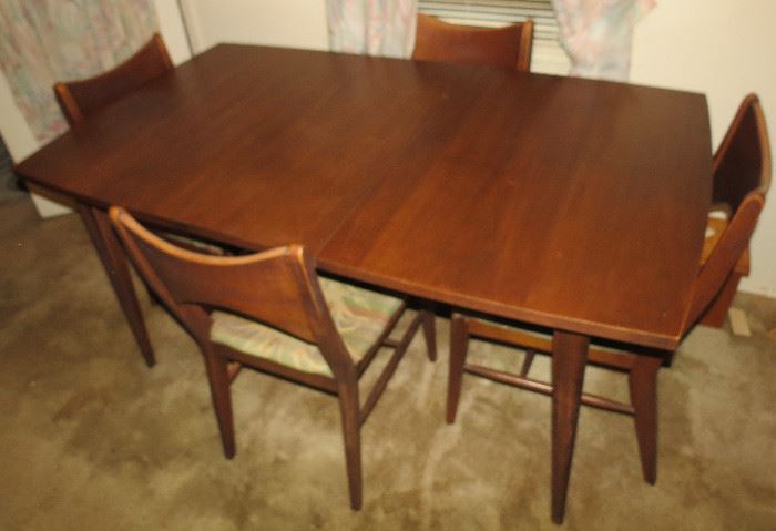 Beautiful Danish Mid Century Formal dining table with 4 chairs and extra leaf.