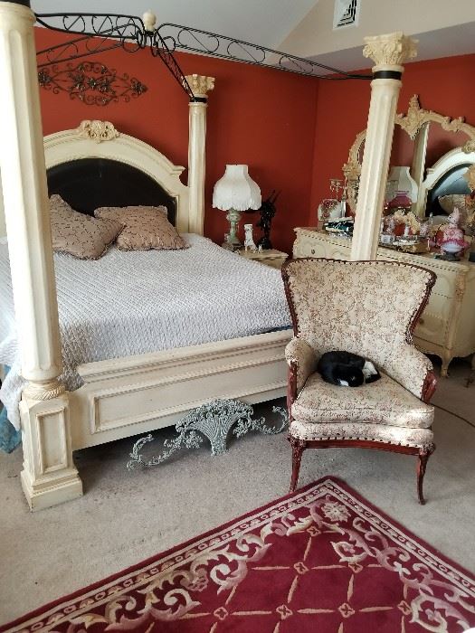 beautiful canopy bed and matching bed room set with a triple dresser and armoire dresser mirror and two night stands
