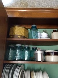 Quart and pint sized Ball blue canning jars with lids. Miscellaneous dish ware and teacups/saucers. Crocks, antique juicer.  Ball jars SOLD