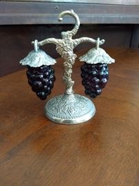 Adorable salt and pepper set. Vintage silver tone with grape cluster shakers. Really nice, but salt shaker is corroded and won’t open.. $15