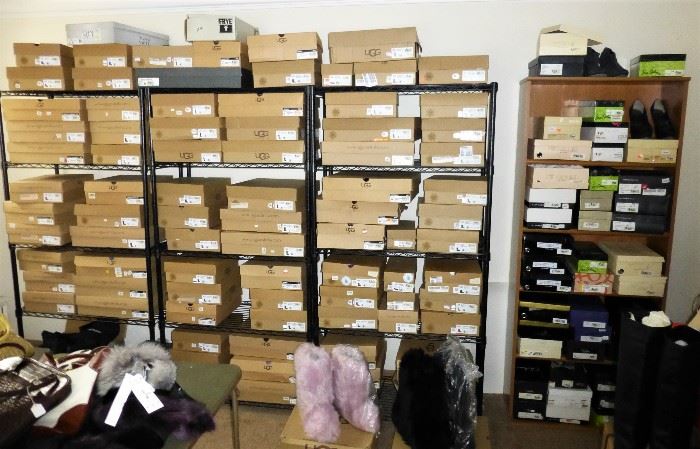 An entire wall of Ugg boots and shoes! 95% were never worn.  Most of the Uggs are sizes 8 and 9 and a few are size 10.