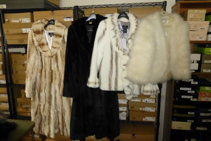 A few of the many Dennis Basso faux fur coats. The vintage marabou feather jacket has been sold.