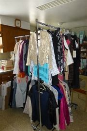 These racks of clothing have been moved to the dining room.