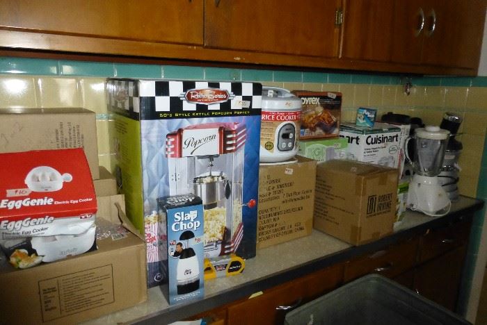 Unused kitchen appliances in boxes.