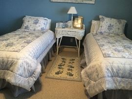 XL Simmons mattresses hardly used. White wicker table.