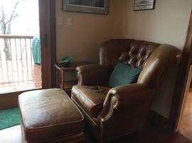 Man's chair. Leather is in decent shape.