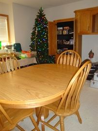 Oak Table 1 leaf 4/chairs, lighted christmas tree, DVD's