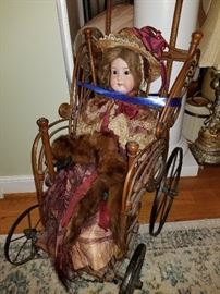 antique doll in stroller carriage