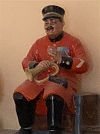 . 



Royal Doulton Figurine Past Glory HN2484, Man Sitting on Trunk Chest w/ Trumpet