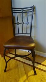 Super Comfortable Wrought Iron Dining Chairs with Decorative Slate Inserts.