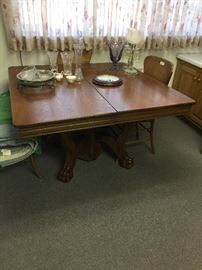 This is the antique dining room table with the four chairs.  This piece is in pristine shape with beautiful carvings
