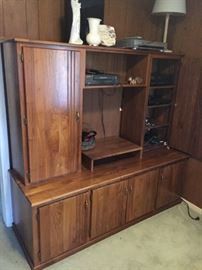 This piece is solid Walnut and made by local cabinet maker, Charles Rawls -- This is an entertainment center, but the top cabinets are not attached, so the cabinet below could be used in so many ways....very versatile!