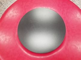 Round padded seat with table area in middle